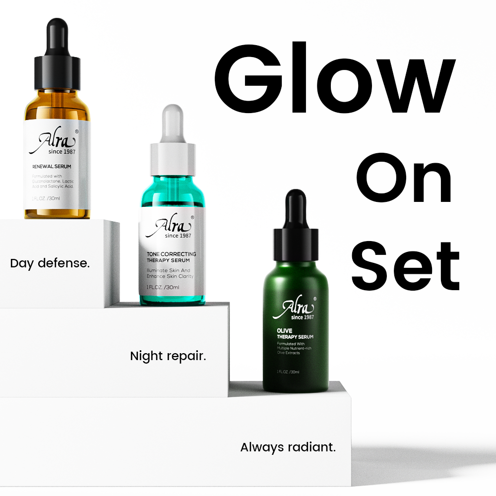 Close-up of glowing skin with labeled benefits from Alra Glow On Set – repair, brighten, and calm from Renewal, Tone Correct, and Olive serums.